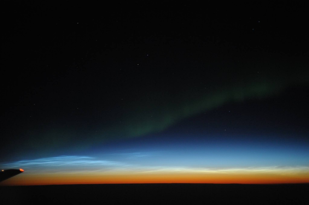 Noctilucent clouds and the Aurora Borealis over western Canada (Joseph A Shaw)